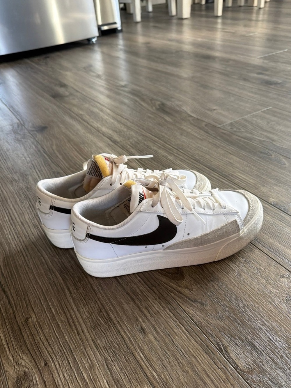 Nike White Sneakers with Black Swoosh and Gray Suede Accents